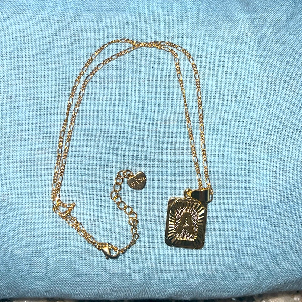 This is a gold necklace with the A initial.